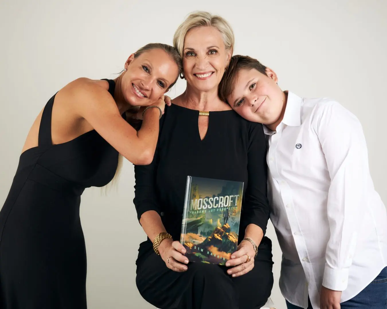 A woman and two boys posing for the camera.